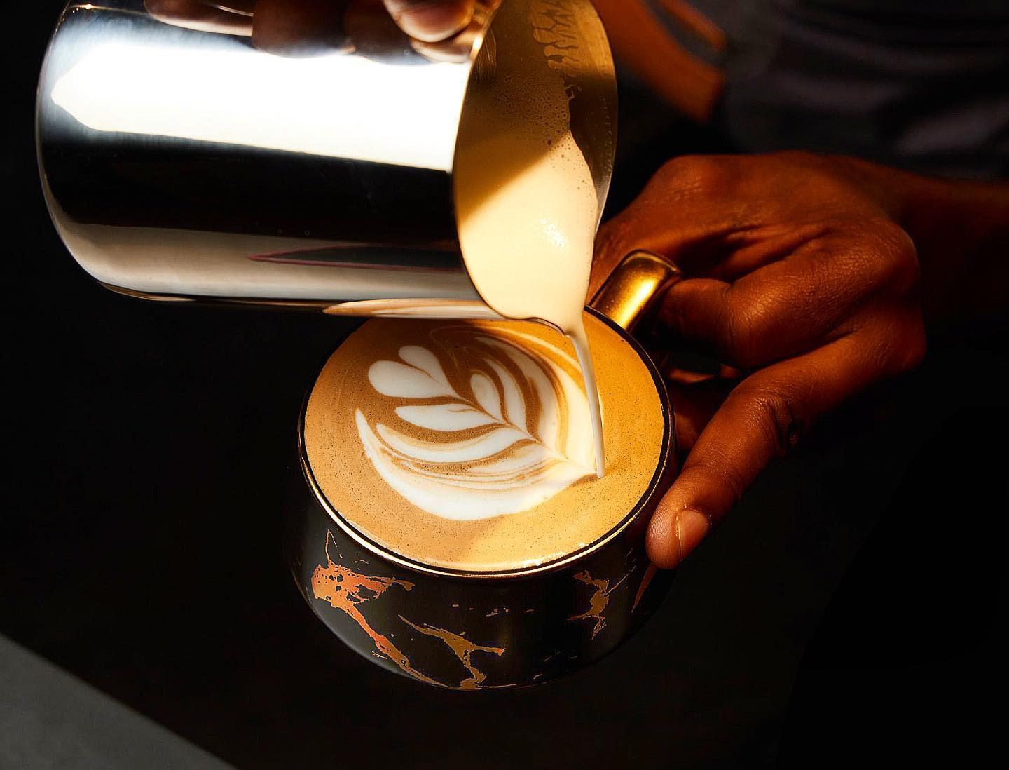 Latte art poured into a Mai Shayi cup